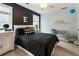 Well-lit bedroom featuring black and white design, a ceiling fan, plush carpet, and a cozy atmosphere at 1450 Crescent Walk, Decatur, GA 30033