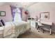 Charming bedroom with a chandelier, decorative accents, and a cozy, inviting atmosphere with a desk and workspace at 1450 Crescent Walk, Decatur, GA 30033