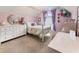 Stylish bedroom featuring a dresser, vanity, chandelier, and desk, offering a comfortable and functional living space at 1450 Crescent Walk, Decatur, GA 30033
