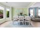 Stylish dining area featuring a modern table, chairs, and scenic bay window views at 1450 Crescent Walk, Decatur, GA 30033