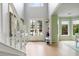 Welcoming foyer with hardwood floors, stairs, and view into the dining room at 1450 Crescent Walk, Decatur, GA 30033