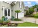 Close up of a charming home's front entrance, featuring a lush garden and a well-maintained lawn at 1450 Crescent Walk, Decatur, GA 30033