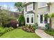 Landscaped front yard with a bay window and double front doors creates an inviting curb appeal at 1450 Crescent Walk, Decatur, GA 30033