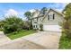 A view of the exterior with well manicured landscaping and a spacious driveway at 1450 Crescent Walk, Decatur, GA 30033