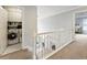 Upstairs hallway with laundry area and a view of the staircase at 1450 Crescent Walk, Decatur, GA 30033