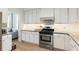 Contemporary kitchen featuring granite countertops, stainless steel appliances, and ample cabinet space at 1450 Crescent Walk, Decatur, GA 30033