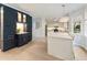 Open-concept kitchen with navy blue cabinets, a center island, and hardwood floors at 1450 Crescent Walk, Decatur, GA 30033