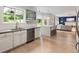 Open kitchen and living area with a view to backyard, granite countertops, and stainless steel appliances at 1450 Crescent Walk, Decatur, GA 30033