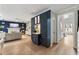 Open-concept living area featuring built-in storage, stylish décor, and seamless access to the foyer at 1450 Crescent Walk, Decatur, GA 30033