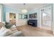 Elegant living room featuring a piano, a decorative mirror, and an open doorway to the kitchen at 1450 Crescent Walk, Decatur, GA 30033