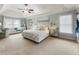 Spacious bedroom features an abundance of natural light, a seating area, and carpet floors at 1450 Crescent Walk, Decatur, GA 30033