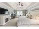 Bright and airy bedroom featuring a fireplace, vaulted ceilings, carpet floors, and plenty of natural light at 1450 Crescent Walk, Decatur, GA 30033