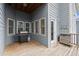 This back porch has a wood floor, grill, an entrance into the house, and wooden railings at 1797 Olive Se St, Atlanta, GA 30315