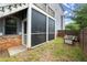 Covered patio featuring a screened-in area with a view to a well-maintained lawn and landscaping at 1797 Olive Se St, Atlanta, GA 30315