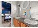 Bathroom features a double sink vanity with granite countertop and view into an adjacent bedroom at 1797 Olive Se St, Atlanta, GA 30315