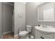 Neutral bathroom with a sleek white vanity and classic fixtures, perfect for a modern touch at 1797 Olive Se St, Atlanta, GA 30315