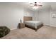 Cozy bedroom featuring neutral tones, soft carpet, and a contemporary ceiling fan for added comfort at 1797 Olive Se St, Atlanta, GA 30315