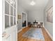Welcoming entryway featuring light-colored wood floors and a cozy seating area for greeting guests with style at 1797 Olive Se St, Atlanta, GA 30315