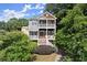 Charming two-story home with double porches, lush landscaping, and inviting curb appeal at 1797 Olive Se St, Atlanta, GA 30315