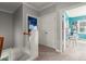 Upstairs hallway with neutral carpet, closet and views into rooms with colorful decor at 1797 Olive Se St, Atlanta, GA 30315