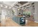 Stylish kitchen with a large island, granite countertops, modern lighting, and an open view to the living area at 1797 Olive Se St, Atlanta, GA 30315