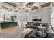 Open concept living area featuring modern decor, recessed lighting, and an adjacent kitchen with stainless appliances at 1797 Olive Se St, Atlanta, GA 30315