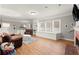 This living room has hardwood floors, recessed lights, brown sofas, and a fireplace at 1797 Olive Se St, Atlanta, GA 30315