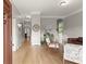 Open-concept living room with hardwood floors, neutral paint, and a staircase at 1797 Olive Se St, Atlanta, GA 30315