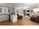 This living room has hardwood floors, recessed lights, brown sofas, a fireplace, and built-in shelves at 1797 Olive Se St, Atlanta, GA 30315