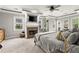Spacious main bedroom with a fireplace, large windows, and a tray ceiling design at 1797 Olive Se St, Atlanta, GA 30315