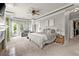 Comfortable main bedroom with a fireplace, large windows, and access to a private balcony at 1797 Olive Se St, Atlanta, GA 30315
