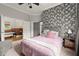 Stylish main bedroom featuring neutral tones and an attached bathroom at 1797 Olive Se St, Atlanta, GA 30315