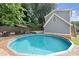 Backyard pool surrounded by a deck, perfect for summer relaxation and outdoor entertainment at 1797 Olive Se St, Atlanta, GA 30315