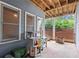 Enclosed porch with playful pet furnishings, perfect for relaxing while enjoying an outdoor view at 1797 Olive Se St, Atlanta, GA 30315
