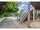 Exterior shot shows a wooden staircase leading to a partial basement and side of the house at 1797 Olive Se St, Atlanta, GA 30315