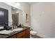 Bathroom featuring granite countertops, updated fixtures and a glass enclosed shower at 201 W Ponce De Leon Ave # 13, Decatur, GA 30030