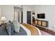 Bedroom with a comfortable bed, wood flooring and stylish decor throughout the space at 201 W Ponce De Leon Ave # 13, Decatur, GA 30030