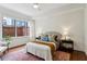 Comfortable bedroom with a cozy bed, soft lighting, and large windows overlooking the outside at 201 W Ponce De Leon Ave # 13, Decatur, GA 30030
