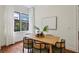 Bright dining area features contemporary decor, wood flooring, and a view to the outside at 201 W Ponce De Leon Ave # 13, Decatur, GA 30030