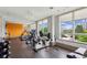Bright fitness center with cardio equipment, weights, and large windows at 201 W Ponce De Leon Ave # 13, Decatur, GA 30030