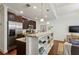Bright, modern kitchen with stainless steel appliances, granite countertops, and an adjacent living space at 201 W Ponce De Leon Ave # 13, Decatur, GA 30030