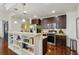 Well-appointed kitchen with granite island, stainless steel appliances, and dark wood cabinets at 201 W Ponce De Leon Ave # 13, Decatur, GA 30030