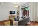 Cozy living room featuring modern furnishings, hardwood floors, and lots of natural light at 201 W Ponce De Leon Ave # 13, Decatur, GA 30030