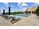 An outdoor pool and lounge chairs offer a relaxing area for residents at 201 W Ponce De Leon Ave # 13, Decatur, GA 30030