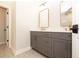 Stylish bathroom featuring double sinks, a modern vanity, and elegant gold fixtures at 205 Midnight Oak Run # 5, Alpharetta, GA 30009