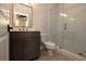 A modern bathroom with a glass shower, stylish vanity, and tile flooring at 205 Midnight Oak Run # 5, Alpharetta, GA 30009