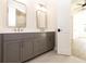 Bathroom featuring a dual sink vanity, quartz countertop, gold fixtures, and wood-look tile at 205 Midnight Oak Run # 5, Alpharetta, GA 30009