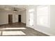 Bedroom highlighting a ceiling fan, modern flooring and a door leading to a balcony at 205 Midnight Oak Run # 5, Alpharetta, GA 30009