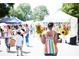 Outdoor market scene featuring local vendors and diverse attendees, creating a vibrant community atmosphere at 205 Midnight Oak Run # 5, Alpharetta, GA 30009