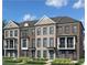 A lovely new townhome with elegant brick, a large porch, and manicured landscaping at 205 Midnight Oak Run # 5, Alpharetta, GA 30009